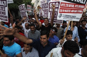 Immigrants shout slogans during an anti-racism rally in Nikaia