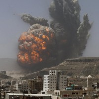 Smoke rises during an air strike on an army weapons depot on a mountain overlooking Yemen's capital Sanaa