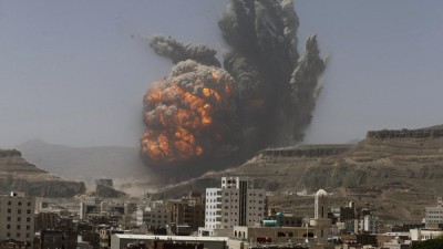 Smoke rises during an air strike on an army weapons depot on a mountain overlooking Yemen's capital Sanaa