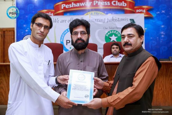 Rehmat Aziz Chitrali Receiving Certificate