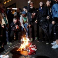 Protesters Burn U.S. Flag