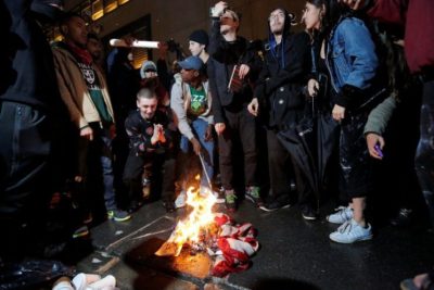 Protesters Burn U.S. Flag