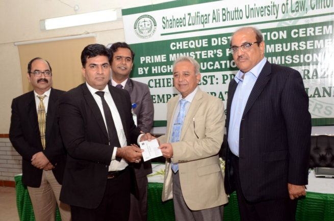 Dr GR Bhatti Giving Check