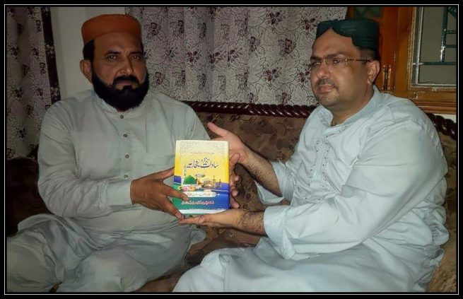 3. Allama Safdar presenting book to Doctor Ali Abbas