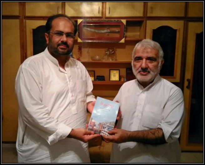 Javed Iqbal Qizlbash presenting opuscule to Dr. Ali Abbas