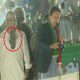 Attempting to throw shoe at Imran Khan